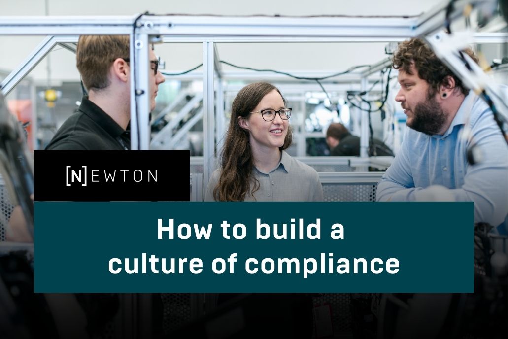 A culture of compliance is visualized by three co-workers talking.